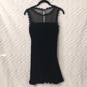 Velvet feeling dress with lace neckline and a button closure. Size XS